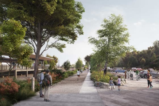 Artist's rendering of the proposed rebuilt Breakneck Ridge station: a long roofed shelter beside the platform on the left, a wide paved concourse with people walking and waiting, and planted verges running down toward the trail.